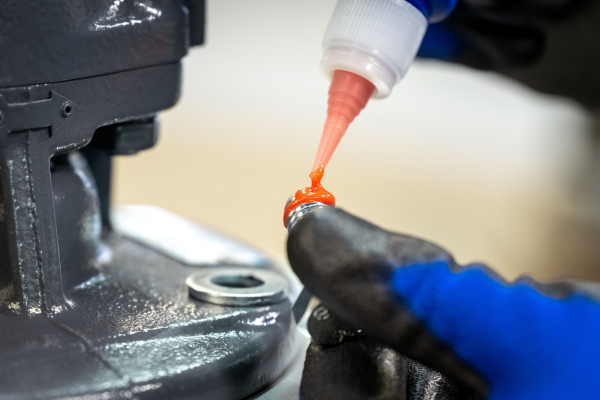 glue, adhesive, caulking, blue glove, metal part